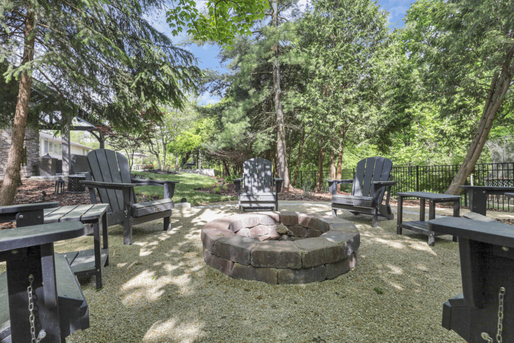 Fireplaces20_floresLLC.jpg - Flores Landscapes Rustic backyard fire pit in Central Ohio