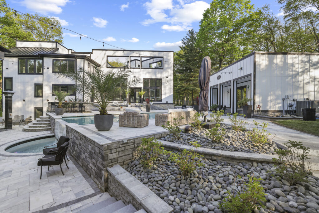 Landscaping21_floresLLC - Flores Landscapes Blended hardscape and landscape project with patio, pool, and tropical plants – Central, OH