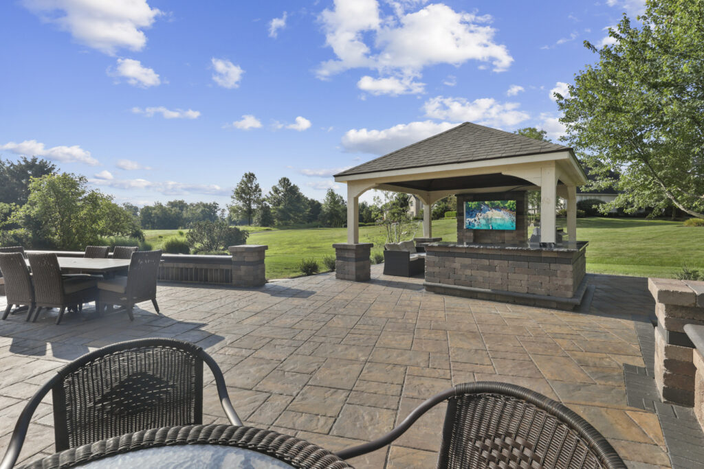 Flores Outdoor Living Space #14 - Flores Landscapes Custom outdoor paver patio with TV and seating in Central Ohio