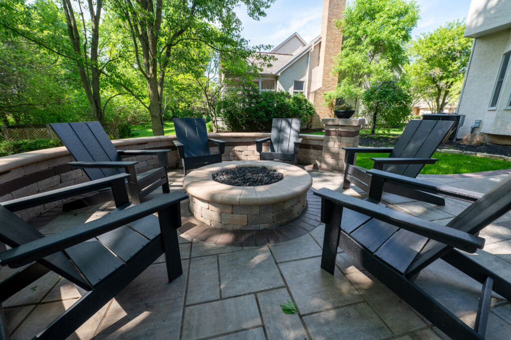 FloresLandscapingBlacklickHoaWall-7 - Flores Landscapes Paver patio with brick fire pit and seating in central Ohio